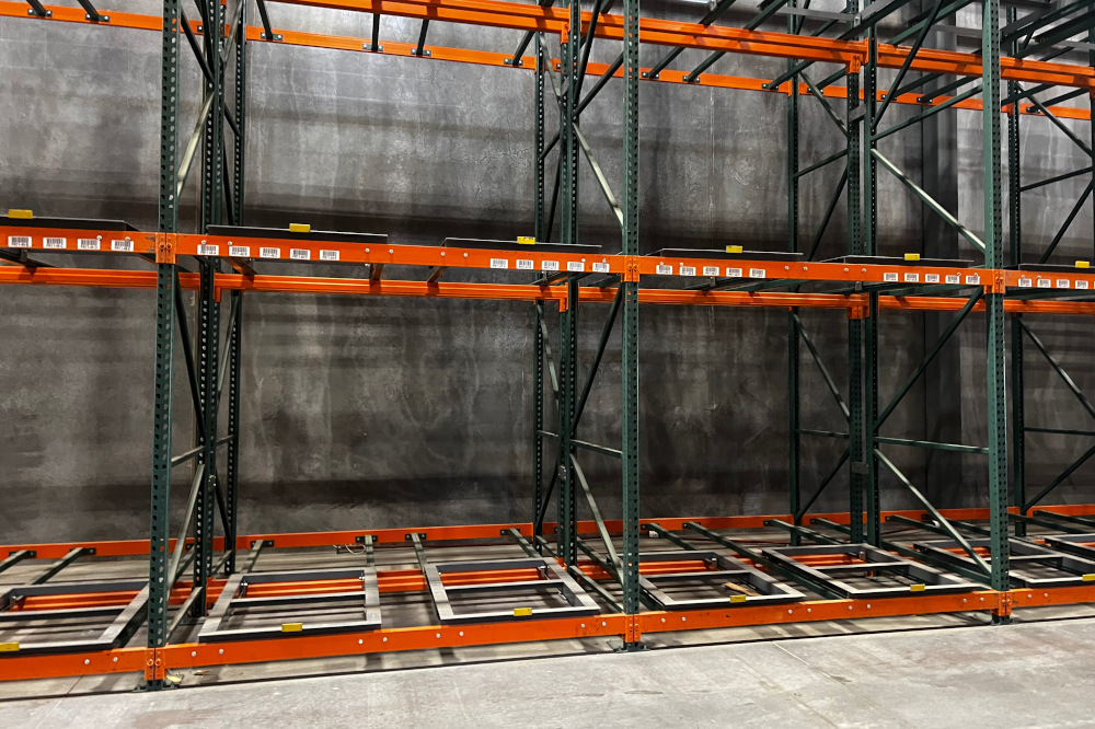 Pushback pallet rack loaded several pallets deep